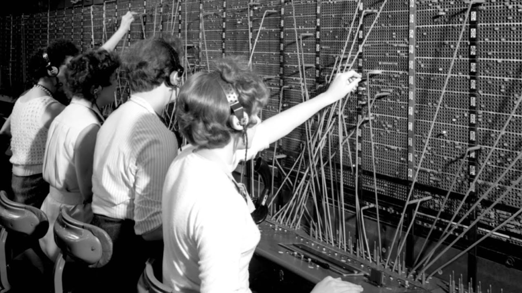 Early telephone exchange operators at a switchboard